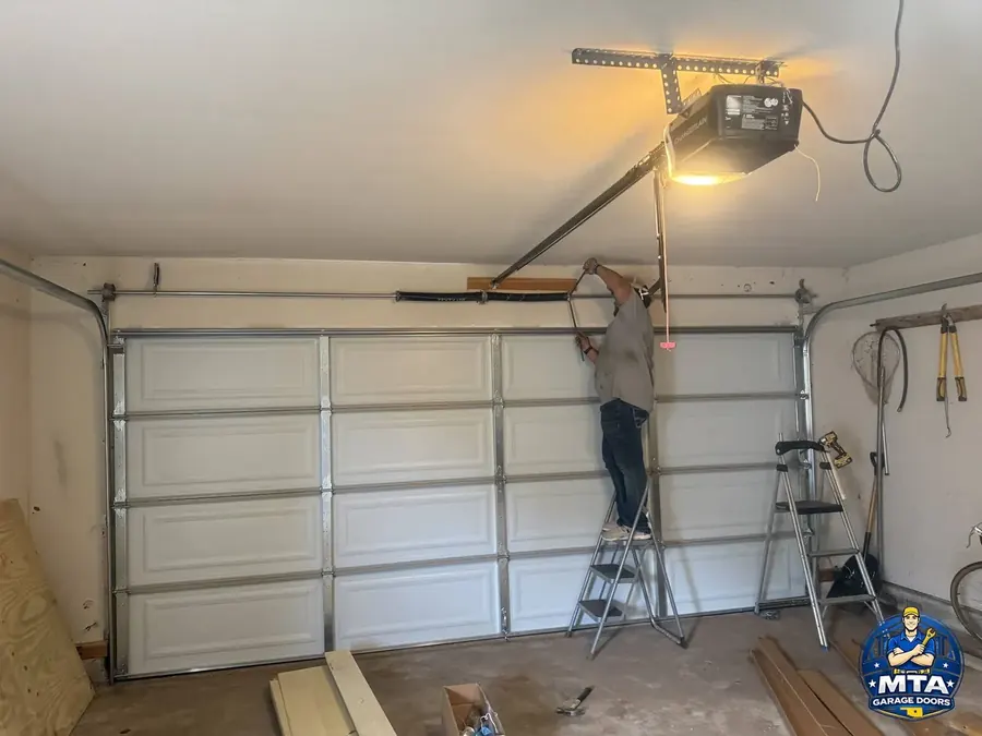 Garage door hardware and track system inside a residential garage